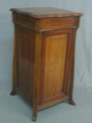 A Continental Edwardian inlaid mahogany serpentine fronted pedestal bedside cabinet, fitted a drawer with cupboard below 18"