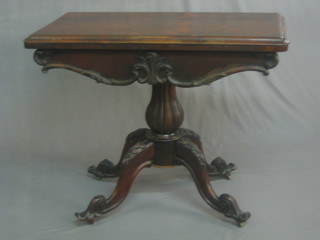 A Victorian D shaped rosewood card table, raised on a carved column and tripod base 36"