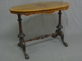 A Victorian inlaid oval figured walnut stretcher table, raised on turned supports with H framed stretcher 36"