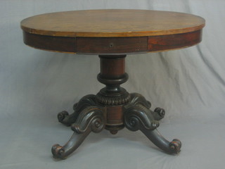 A Victorian oval rosewood occasional table fitted a drawer, raised on pillar and tripod supports 38"