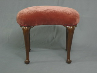 A walnut kidney shaped dressing table stool, raised on cabriole supports 25"