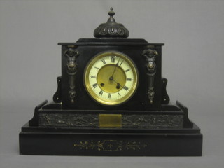 A Victorian French 8 day striking clock contained in a slate finished architectural case