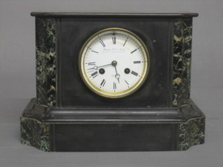 A Victorian French 8 day striking mantel clock contained in a 2 colour marble case