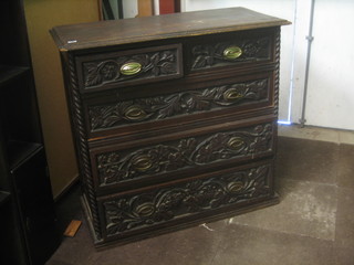 A 19th Century heavily carved oak chest of 2 short and 3 long drawers 40"