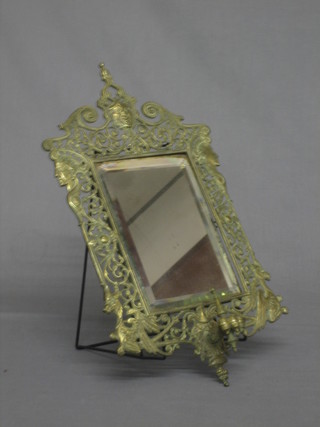 A Victorian rectangular bevelled plate mirror  contained in a pierced brass frame 19"