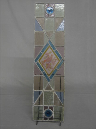 A rectangular stained glass panel 29" x 8"
