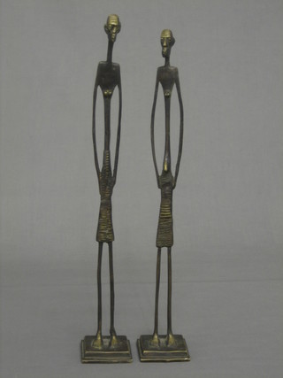A pair of Eastern bronze figures of standing people 17"