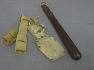 A turned wooden Police truncheon, a turned leather bayonet frog and 2 webbing bayonet frogs