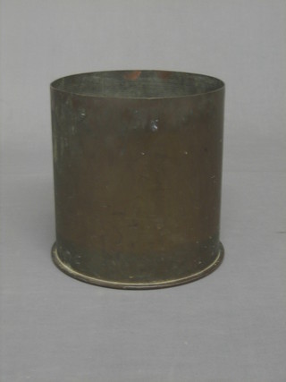 A large brass shell case marked 1916