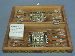 An Eastern inlaid hardwood chess/backgammon board 12"