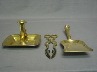 A 19th Century square brass chamber stick and snuffer, a coal shovel and a pair of coal tongs