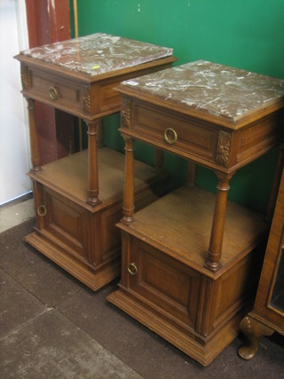 A pair of French 19th Century oak 3 tier bedside cabinet with pink veined marble tops fitted a drawer above recess with cupboard below enclosed by panelled doors 16"