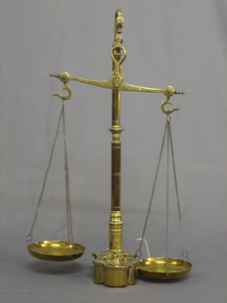 A pair of Victorian brass scales the base fitted 6 weights together with 3 additional weights