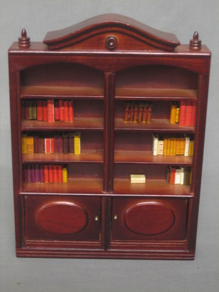 A dolls house arch shaped library bookcase fitted various shelves 6 1/2"