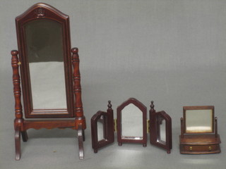 A dolls house cheval mirror 2", a triple plate mirror 1" and a dressing table mirror 1"