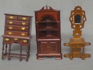 A dolls house mahogany hall stand, a chest on cabinet (f) and a mahogany corner cabinet