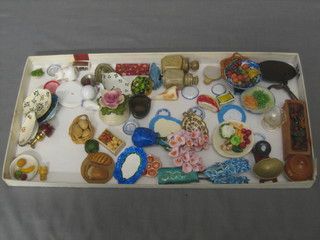 A collection of miniature dolls house effects including scales, bread board, plates etc, etc,