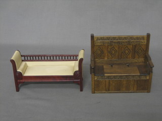 A dolls house carved oak settle with hinged lid 5" and a Regency style mahogany sofa 5"