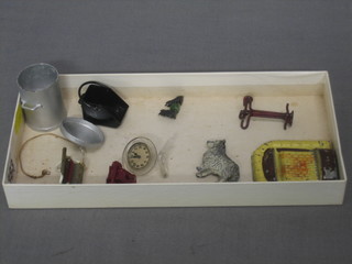 A dolls house metal rubbish bin, do. coal scuttle, metal fire insert, electric fire, telephone, clock, figure of a dog etc