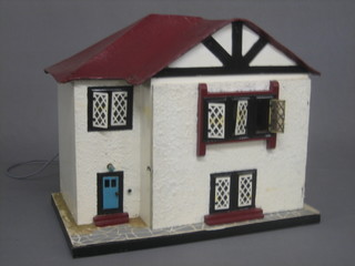A dolls house in the form of a 1930's detached house 19"