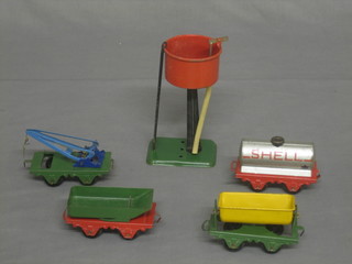 A Hornby O gauge No.1 water tanker, a Hornby petrol tanker no. 20, a side tipping wagon no.20, a rotary tipping wagon and a MO grain truck, all boxed