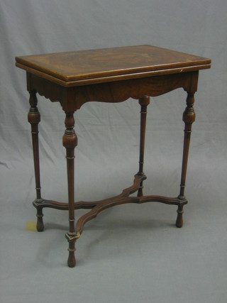 A rectangular Queen Anne style walnut card table, raised on turned supports with X framed stretcher 24"