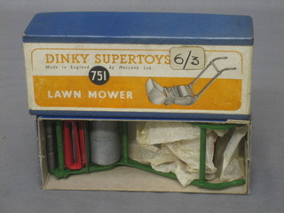 A Dinky 751 model lawn mower boxed