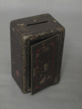 A childs money box in the form of a Chubb Safe