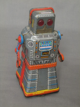 A Japanese clockwork tin plate toy in the form of a robot marked KO