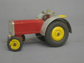 A wooden and metal model of a tractor