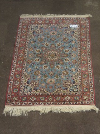 A fine quality turquoise ground and floral patterned Persian rug with central medallion within floral borders 61" x 40"