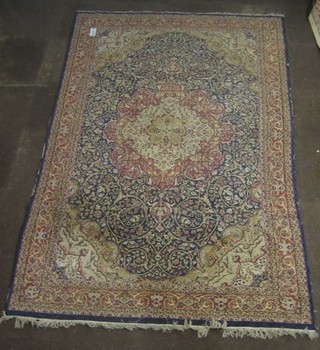 A fine blue ground and floral patterned Persian rug with medallion to the centre 109" x 71"