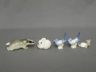 A Soviet Russian porcelain figure of a badger 4" together with 3 small figures - 2 birds, a dog and a rabbit