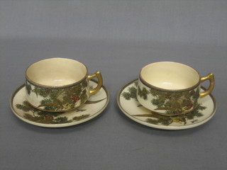 A pair of Japanese Satsuma porcelain cups and saucers