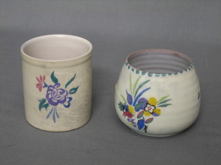 A circular Poole Pottery floral decorated vase the base with impressed Poole mark and 288 3" and a cylindrical vase with Dolphin mark 286 3"