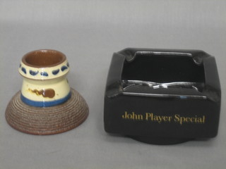 A circular Torquay match striker 3" and a square Wade ashtray marked John Player Special 4"