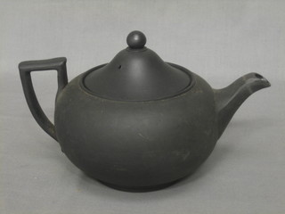A Wedgwood black basalt teapot, base marked Made in England and incised 18