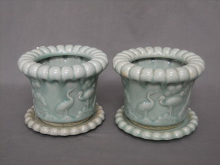 A pair of Oriental turquoise glazed jardinieres decorated storks 6"