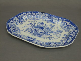 A large blue and white oval meat plate (large chip to rim)