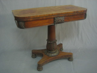 A William IV mahogany D shaped card table raised on a turned column with triform base 36"