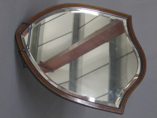 An inlaid mahogany shield shaped mirror  22"