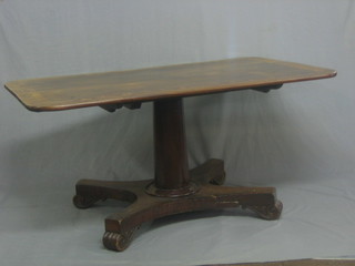 A William IV rectangular mahogany breakfast table with crossbanded top, raised on a turned column and triform base 58"