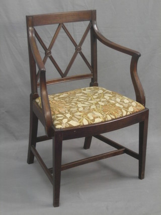 A 19th Century mahogany bar back desk chair with tracery back and upholstered drop in seat, raised on square tapering supports