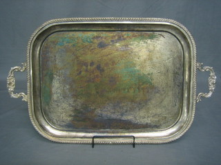 A silver plated twin handled tea tray with gadrooned decoration 28"