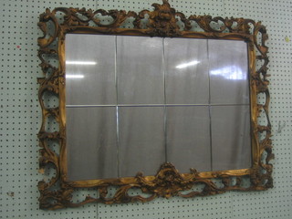 A rectangular cut glass plate mirror contained in a carved gilt frame 34"