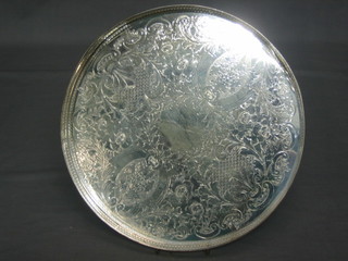 A circular silver plated salver with pierced gallery 11"
