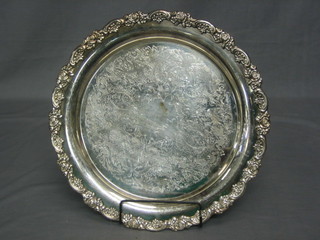 A circular engraved silver plated salver with cast border 15"