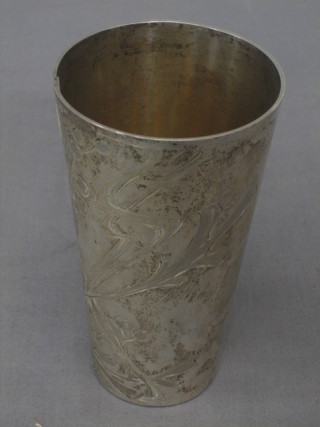 An Art Nouveau style Continental waisted silver beaker with engraved decoration