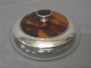 A circular Art Deco cut glass powder bowl with silver rim and tortoiseshell mounts, Birmingham 1928