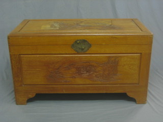 A carved camphor coffer with hinged lid 40" 